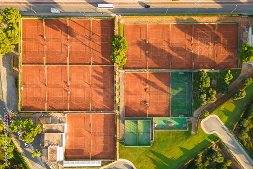 Aerial view from drone of empty tennis courts and football field