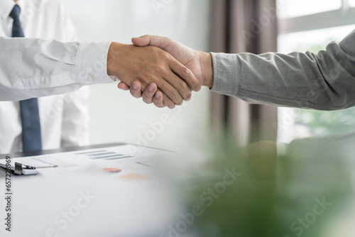 Businessman shaking hands successful making a deal. mans handshake. Business partnership meeting concept