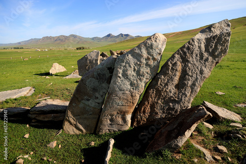 Deer stone monuments and square graves of Temeen Chuluu, Mongolia photo