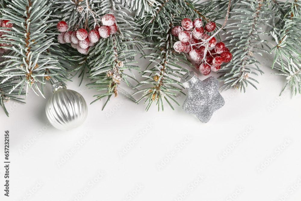 Christmas card with fir branches and Christmas decorations. Copy space