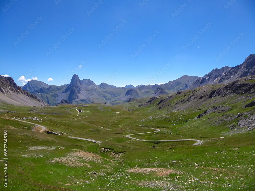 Scenic mtb trail with view of Rocca La Meja near rifugio della Gardetta on the Italy French border in Maira valley in the Cottian Alps, Piedmont, Italy, Europe. Hiking on sunny summer day in mountains