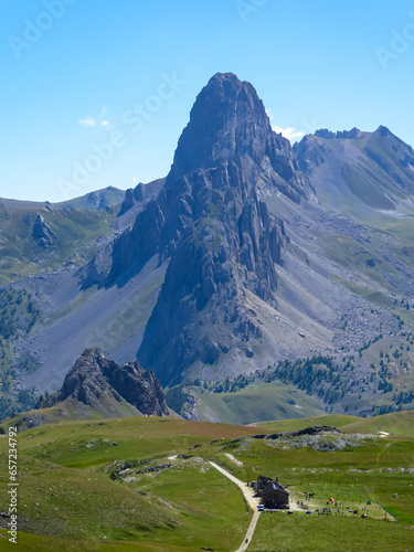 Scenic mtb trail with view of Rocca La Meja near rifugio della Gardetta on the Italy French border in Maira valley in the Cottian Alps, Piedmont, Italy, Europe. Hiking on sunny summer day in mountains photo