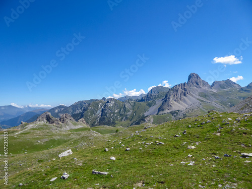 Scenic mtb trail with view of Rocca La Meja near rifugio della Gardetta on the Italy French border in Maira valley in the Cottian Alps, Piedmont, Italy, Europe. Hiking on sunny summer day in mountains photo