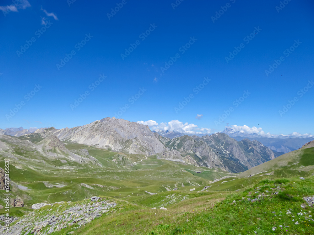 Scenic view from Monte Oserot near rifugio della Gardetta on Italy French border in Maira valley in Cottian Alps, Piedmont, Italy, Europe. Hiking on alpine pasture on sunny summer day in mountains