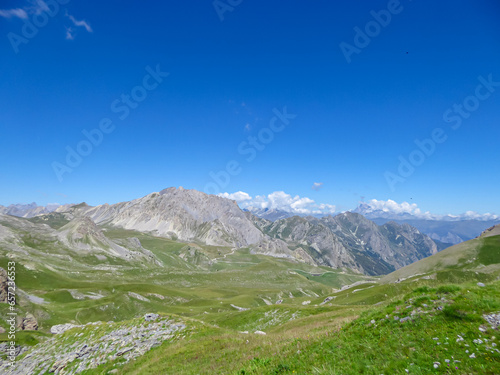 Scenic view from Monte Oserot near rifugio della Gardetta on Italy French border in Maira valley in Cottian Alps, Piedmont, Italy, Europe. Hiking on alpine pasture on sunny summer day in mountains