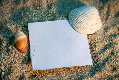 Blank paper on sand background with copy space for your text.