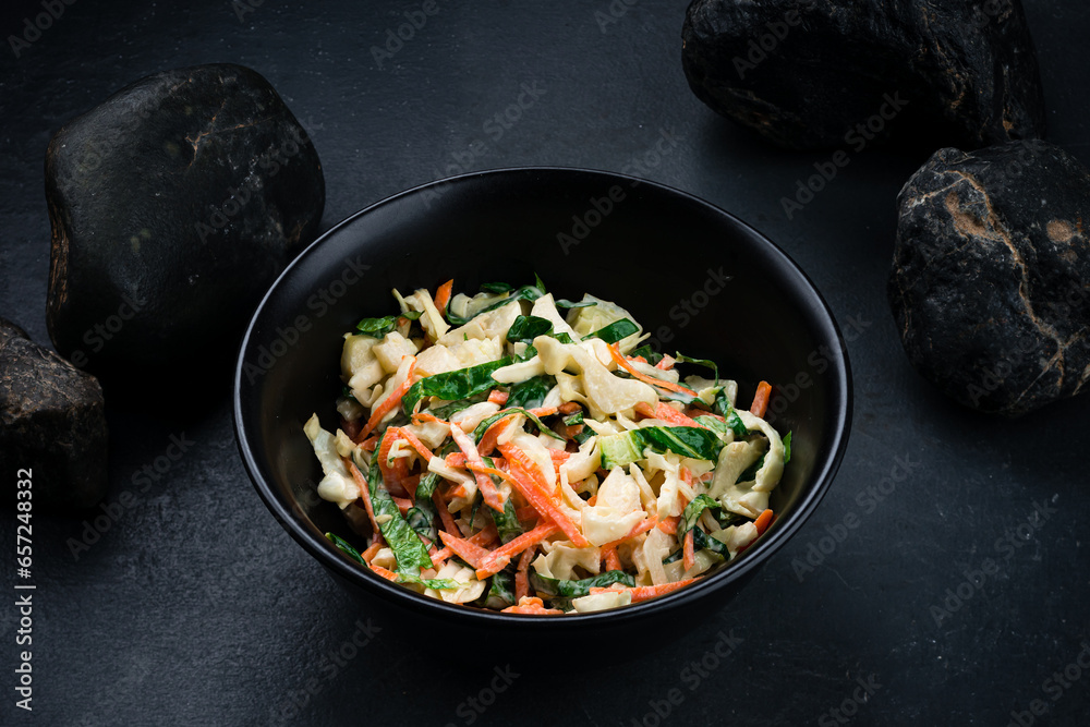 Raw salad with cabbage, carrot, apple and lettuce in bowl. Raw salad with cabbage, carrot, apple and lettuce in bowl.