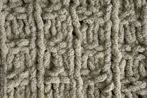 Dark brown handmade knitting blanket background.