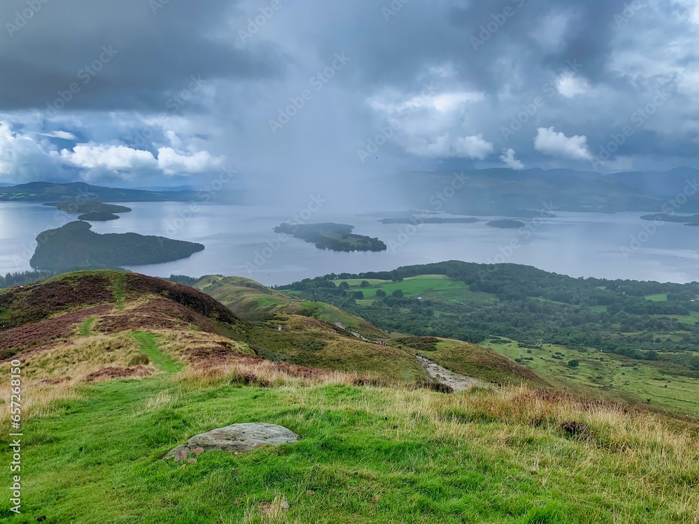 View of loch lomond lake water from conic hill in scotland when hiking and walking View of loch lomond lake water from conic hill in scotland when hiking and walking