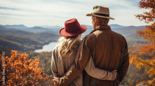 Man holds woman from behind while looking out at a scenic view
