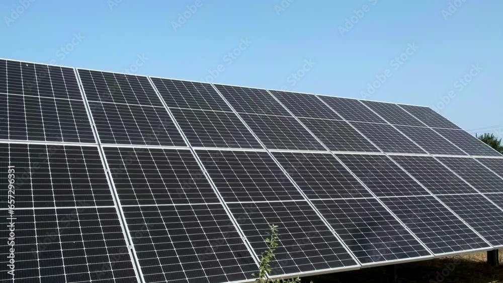 Closeup of surface of blue photovoltaic solar panels mounted on building roof for producing clean ecological electricity. Production of renewable energy concept. Closeup of surface of blue photovoltaic solar panels mounted on building roof for producing clean ecological electricity. Production of renewable energy concept.