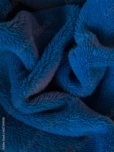 wrinkled blue fluffy blanket. texture