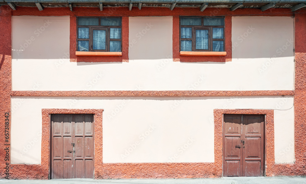 Street view of the facade of an old colonial building, architecture background, Ecuador.