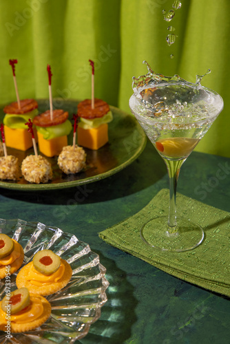 Retro hors d’oeuvres  with martini and splash