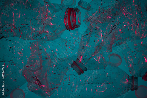 Horizontal backlit blue plastic bottles