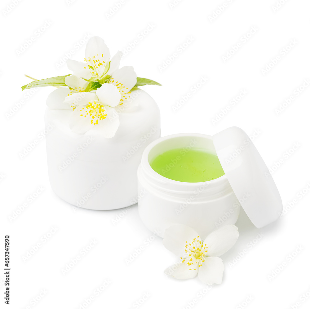 Jars of cosmetic products with beautiful jasmine flowers on white background