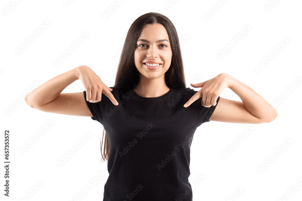 Young woman pointing at her black t-shirt on white background Young woman pointing at her black t-shirt on white background
