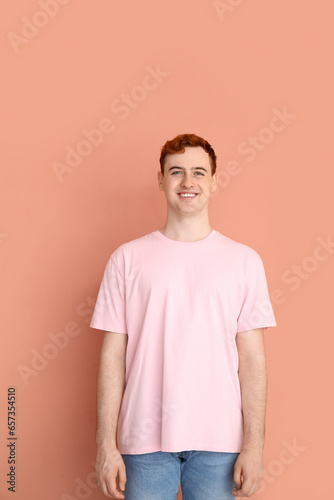 Wallpaper Mural Young man in t-shirt on beige background Torontodigital.ca