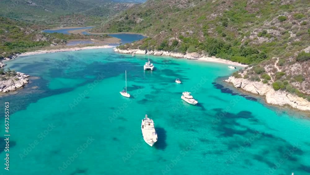 Splendid bay with turquoise water and boats anchored at anchor, aerial shots Splendid bay with turquoise water and boats anchored at anchor, aerial shots
