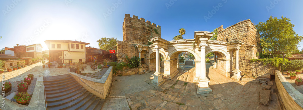 Fototapeta premium panorama of marvel gate of Roman architecture Hadrian's Gate in Antalya, Turkey from 2nd century AD It's offering a captivating glimpse into the city's rich historical heritage and archaeological site