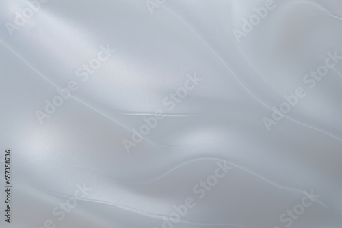 Closeup of a frosted translucent plastic, showcasing a soft matte finish with a cloudy appearance and a slightly pliable texture.