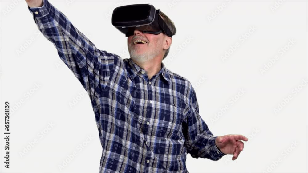 Happy senior man in vr headset exploring the virtual reality. Isolated on white. Happy senior man in vr headset exploring the virtual reality. Isolated on white.