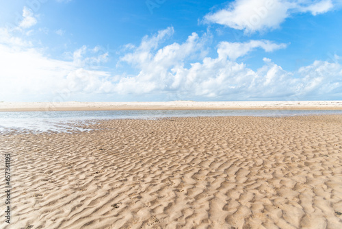 Waters from a river that flows into the sea. white sand on the beach. Preserved environment.