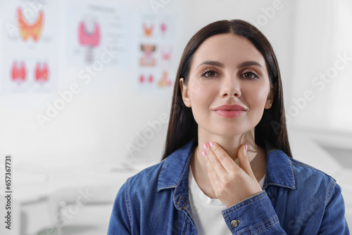 Endocrine system. Young woman doing thyroid self examination indoors, space for text photo