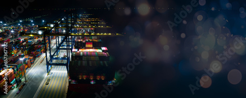 Rear view of container ship loading and unloading at cargo shipping port at night, freight transportation, nautical vessel, cargo container in deep seaport for the international order concept.