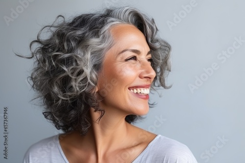 Smiling happy Beautiful mature woman looking away photo