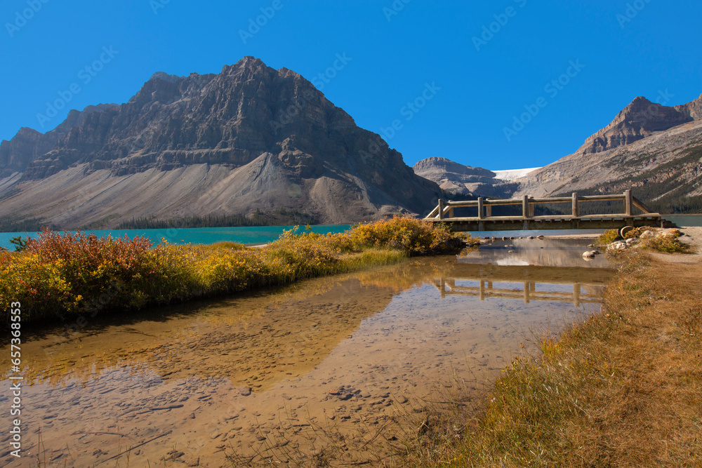 Stunning scenery at Bow Lake with reflections and fall colors along the Icefields Parkway in Banff National Park, Alberta, Canada
