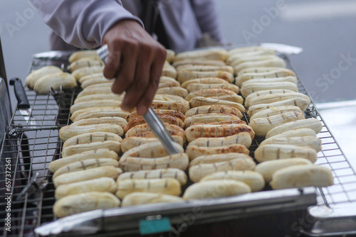 Grilled bananas are sold and prepared on the streets in Vietnam