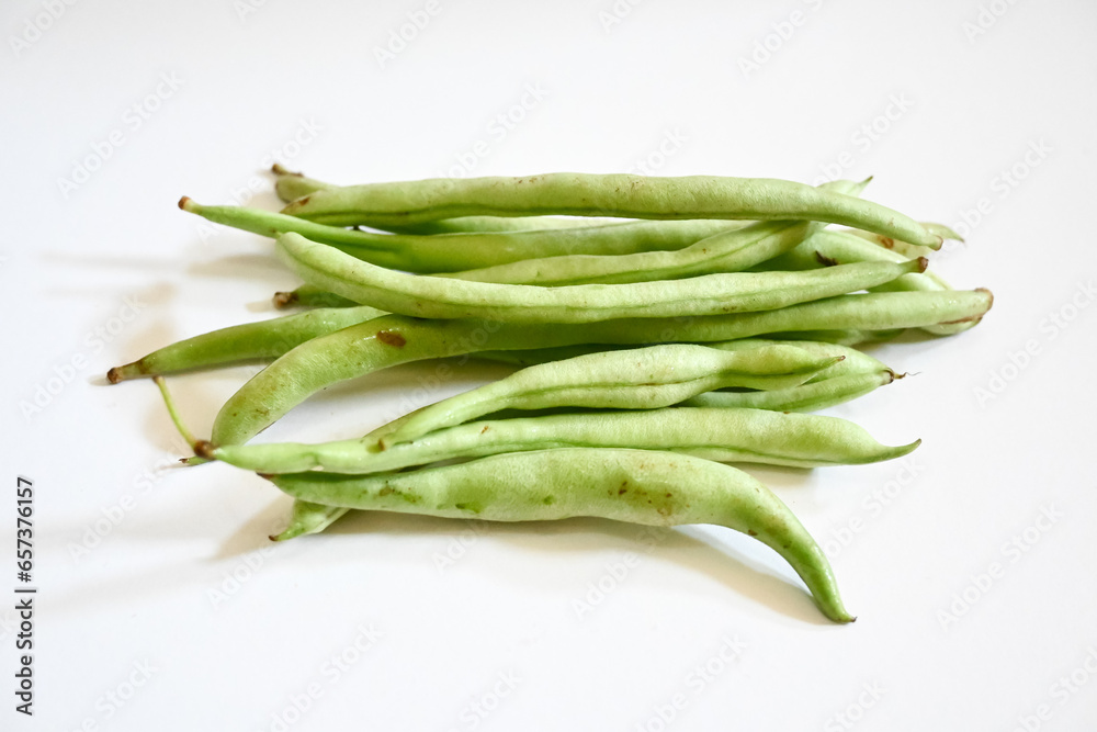 bunch of green beans on isolated white background. Buncis or Phaseolus vulgaris or Phaseolus esculentus. bunch of green beans on isolated white background. Buncis or Phaseolus vulgaris or Phaseolus esculentus.