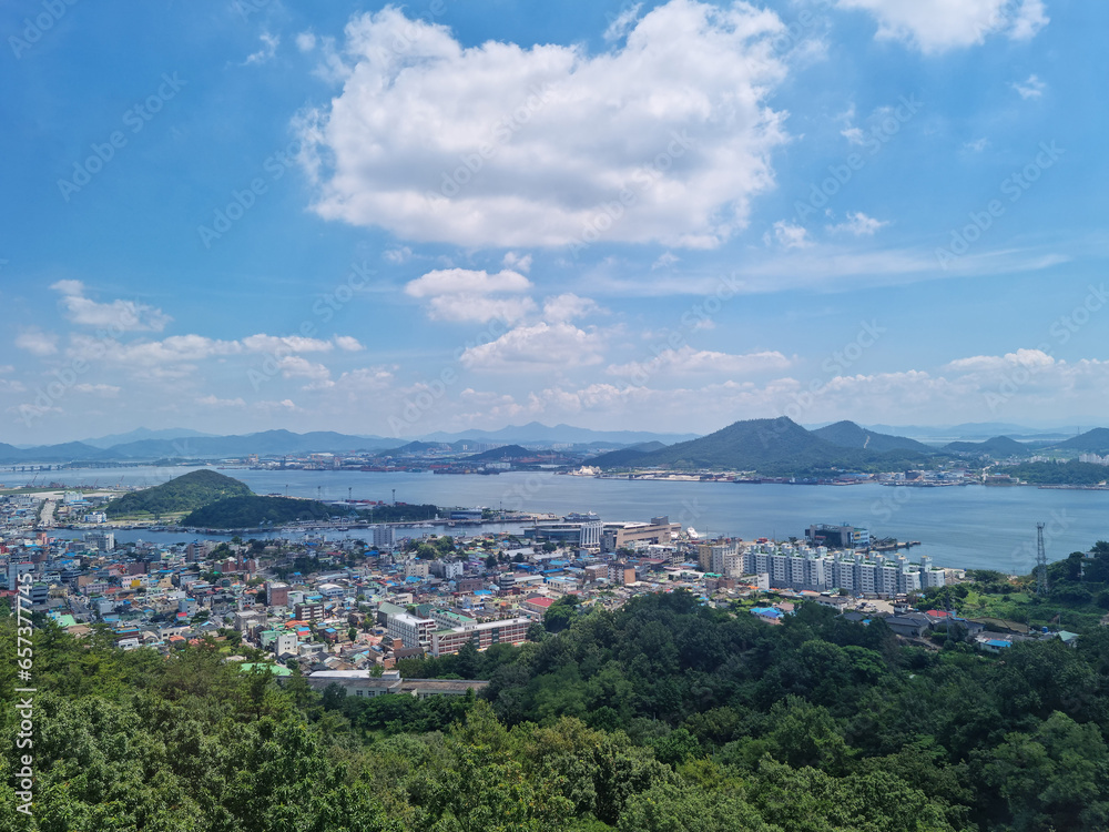 This is an aerial shot of downtown Mokpo, with the sea visible in the distance.