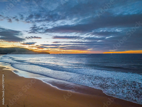 Surf  sea  sand  sunrise with clouds