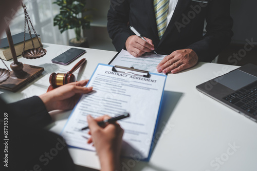 A lawyer or legal advisor is reading the statute of limitations. Clarifying details of legal contracts before signing. Consultation between lawyers and business clients. Legal services company.