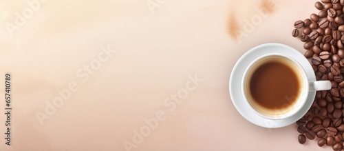 Top view of a isolated pastel background Copy space with a cup of coffee and beans providing space for text