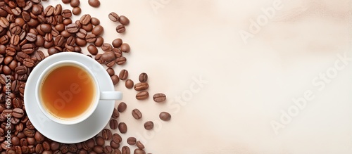 Top view of a isolated pastel background Copy space with a cup of coffee and beans providing space for text