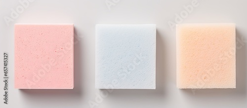 Three sponges in kitchen isolated isolated pastel background Copy space photo