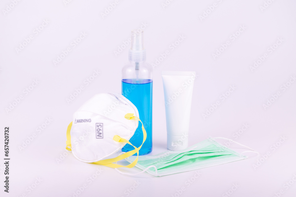 Rubbing alcohol bottle gel with hygienic mask protect virus on white background Rubbing alcohol bottle gel with hygienic mask protect virus on white background