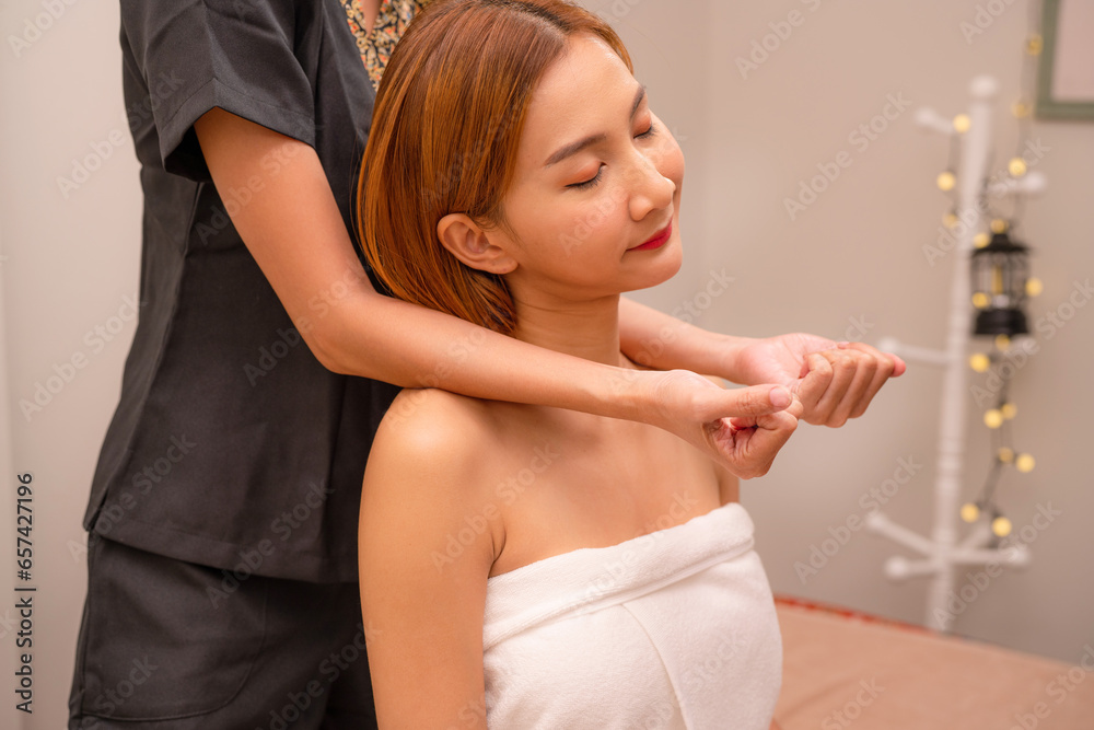 Naklejka premium Massage and body care. Spa woman body massage, hands treatment. Woman having massage in spa salon for beautiful girl. 