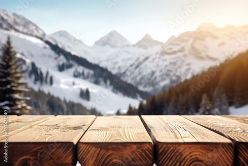 The empty wooden table top with blur background of Alpine with snow capped. Exuberant image. © Summit Art Creations