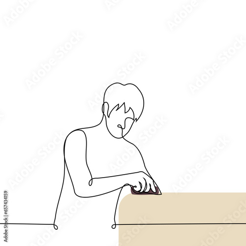 man sanding wood with sandpaper or doing cleaning - one line art vector. wood processing concept, craftsman at work on wood, cleaning
