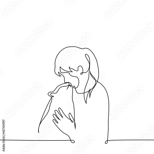 woman strokes and hugs a cat who kisses her - one line art vector. concept mutual love between cat and woman