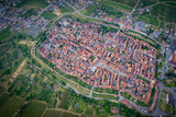 Aerial view above the beautiful French village of Bergheim and its surrounding vineyards - Alsace, France