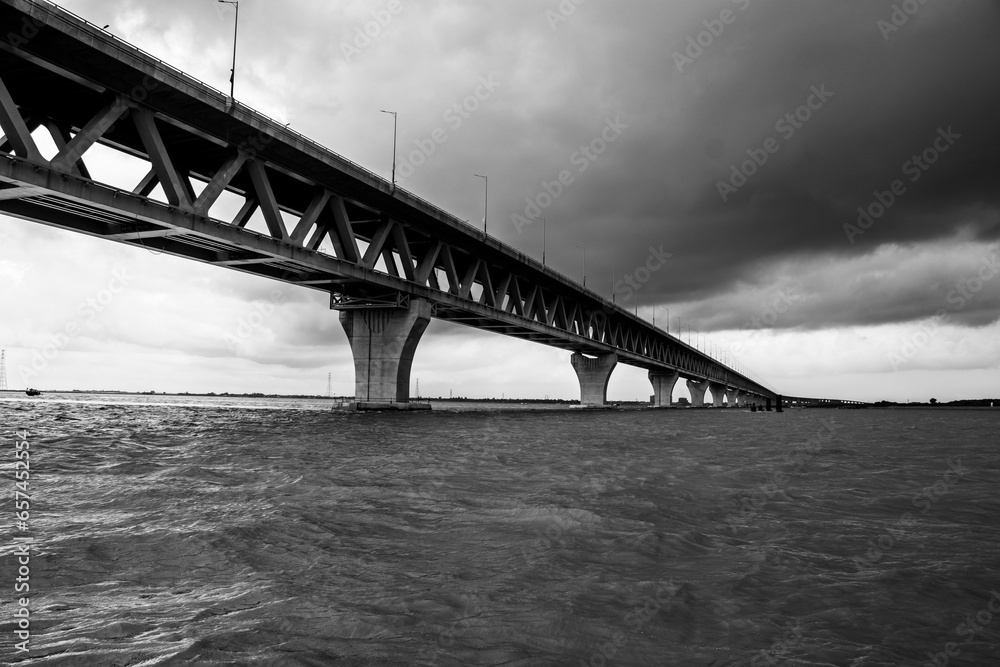 Most extensive Padma bridge photography under the dark cloudy sky