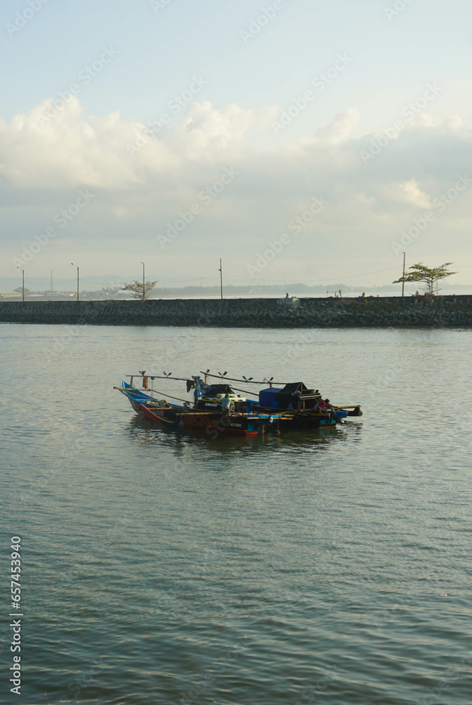 Fototapeta premium Fishing boats sailing for fish on a sunny morning