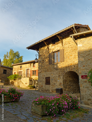Market square of Riverie medieval village in the morning light, France