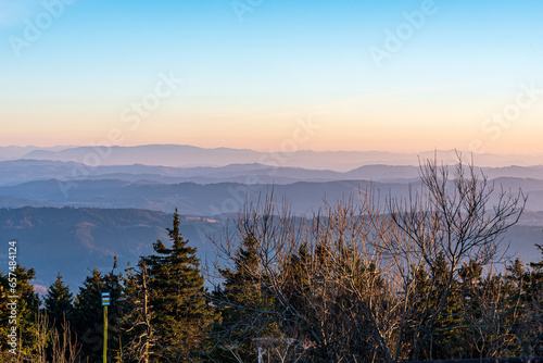 View from Lysa hora hill summit in Moravskoslezske Beskydy mountains during sunset photo