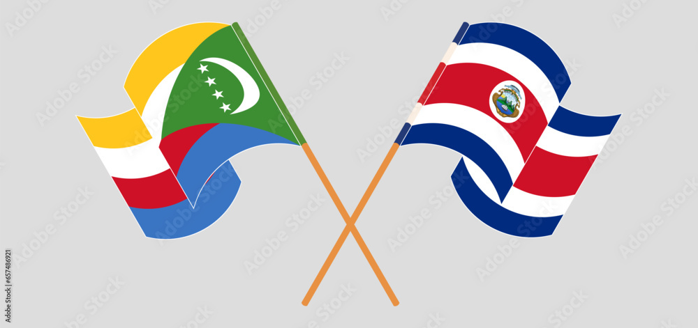 Crossed and waving flags of the Comoros and Costa Rica